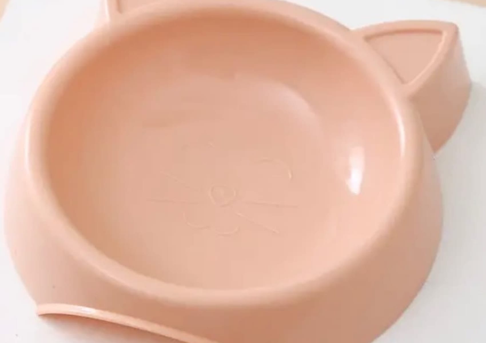 Pink cat shaped food or water bowl with cat face