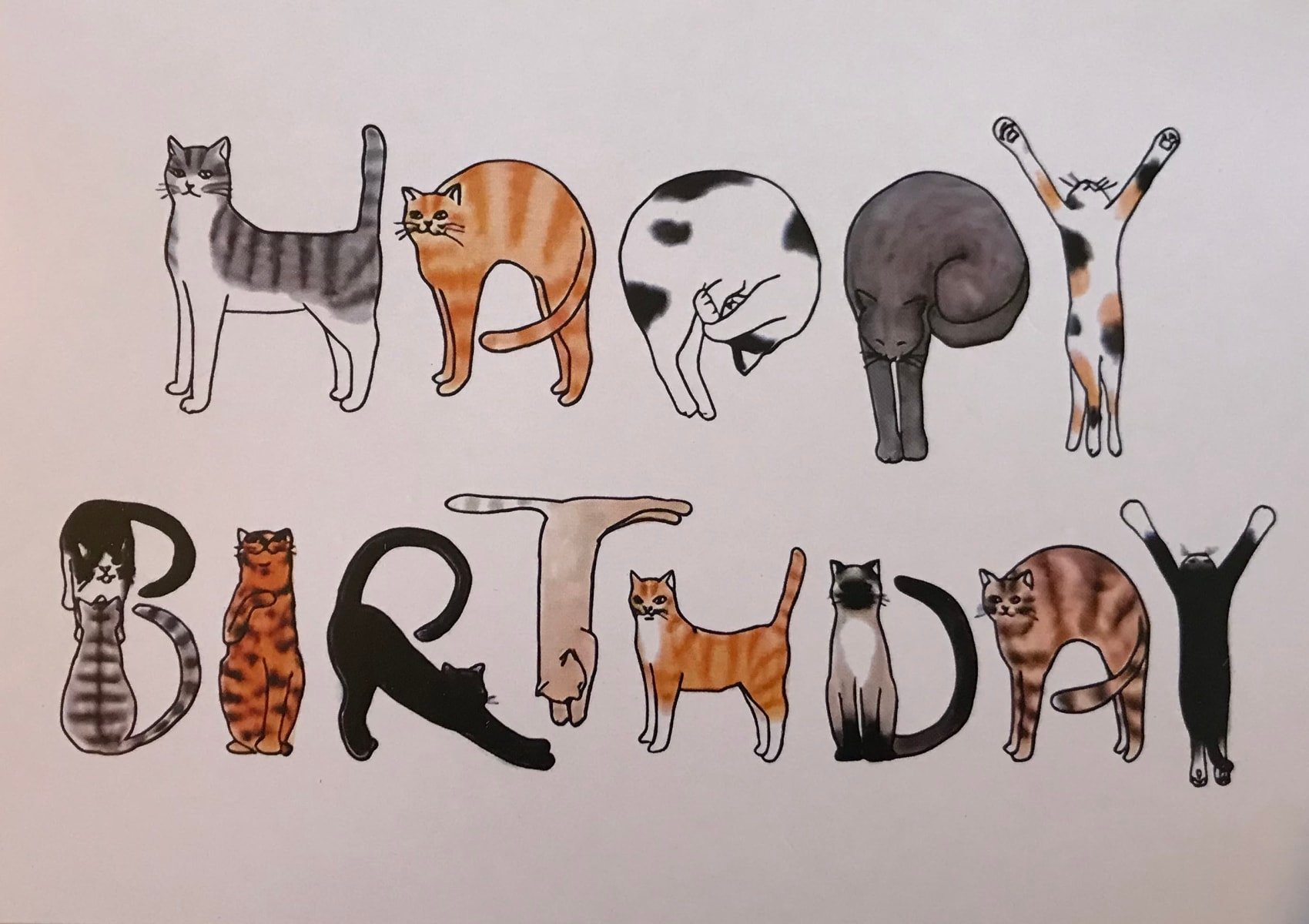 Happy birthday card with acrobatic cats making the letters