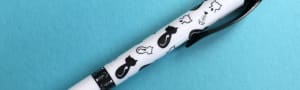 White click pen with black and white cat designs