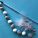 Grey pom pom and feather cat toy on sale at Yorkshire Cat Rescue